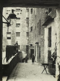 View of children outside Nos 3, 5, 7 and 10 Milne's Court, Edinburgh
Titled: 'Milne's Court, High Street.  August 1904' 
PHOTOGRAPH ALBUM No.30: OLE EDINBURGH ALBUM
