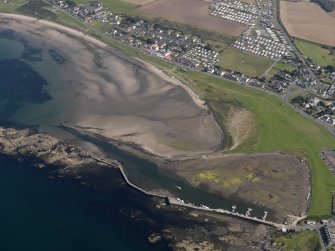 Oblique aerial view centred on Maidens harbour and village, taken from the W.