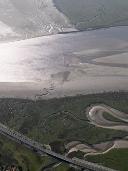 Oblique aerial view of the fish trap stakes of Scaur Fishery on the River Cree, taken from the ENE.