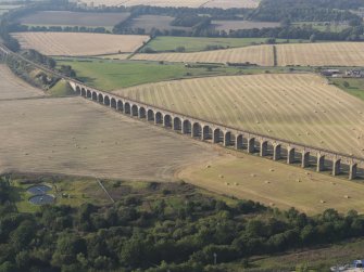 Oblique aerial view looking along the Almond Valley Railway viaduct, taken from the SSW.