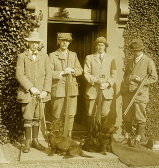 View of a group of people with guns and dogs at Williamwood House