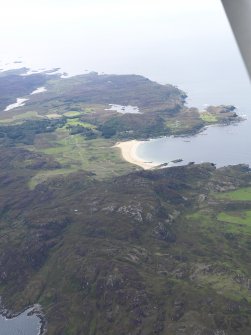 General oblique aerial view of the north end of Colonsay looking across Kiloran Bay, taken from the NE.