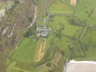 Oblique aerial view of Oronsay Farm and Priory, taken from the WNW.