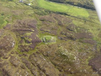 Oblique aerial view of Dun Eibhinn and Scalasaig Farm, taken from the NW.