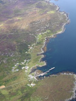 General oblique aerial view of Scalasaig and Glas Aird (Glassard), taken from the SSW.