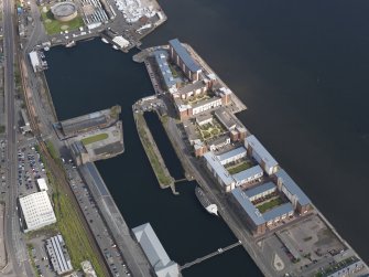 General oblique aerial view of the harbour area, centred on the Victoria Dock taken from the W.