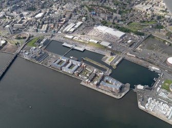 General oblique aerial view of the harbour area, centred on the Victoria Dock taken from the ESE.