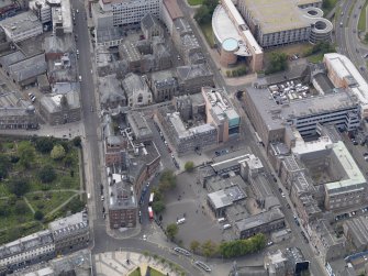 General oblique aerial view of the Bell Street area, centred on the DC Thompson Building taken from the ENE.