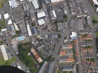 Oblique aerial view of the former mill site taken from the W.
