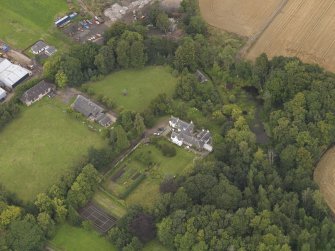 General oblique aerial view of the Grange of Gagie centred on the house taken from the SSE.