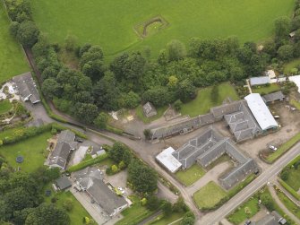 General oblique aerial view of the Tealing Home Farm centred on the dovecot taken from the E.