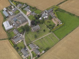 General oblique aerial view of Kirkton of Tealing centred on the church taken from the SSW.