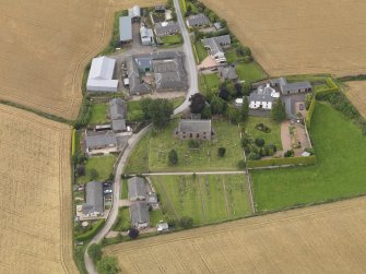 General oblique aerial view of Kirton of Tealing centred on the church taken from the S.