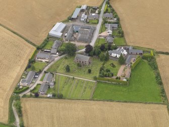 General oblique aerial view of Kirton of Tealing centred on the church taken from the SSE.