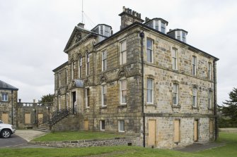 View of Cumbernauld House, Cumbernauld, taken from the South. The image shows the South-West (principle) and South-East elevations. The connecting corridor to the Eastern Pavilion can be seen to the left of the image.