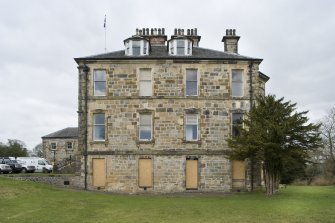General view of Cumbernauld House, taken from the South-East, showing the South-Eastern elevation of the main house and the Eastern Pavilion.