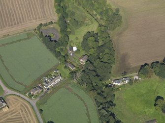 General oblique aerial view of Woodside Cottages, centred on the mill taken from the SE.