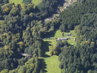 General oblique aerial view of the Panmure  Estate, centred on the West Gate, taken from the ENE.