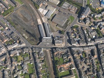 General oblique aerial view of central Arbroath, centred on the railway station, taken from the SSW.