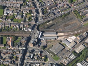 General oblique aerial view of central Arbroath, centred on the railway station, taken from the ESE.