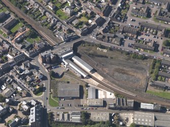 General oblique aerial view of central Arbroath, centred on the railway station, taken from the NE.