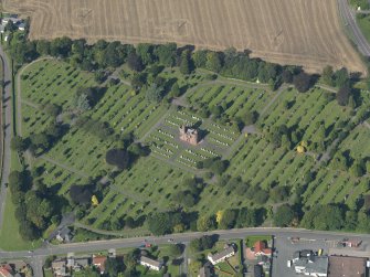 General oblique aerial view of the Western Cemetary, Arbroath, centred on the mortuary chapel, taken from the SE.