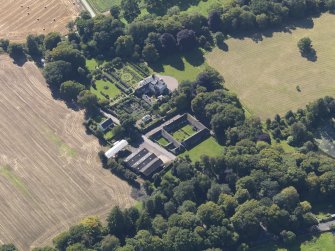 General oblique aerial view of the Pitmuies Estate, centred on  Pitmuies House, taken from the NE.