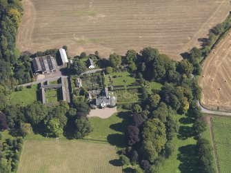 General oblique aerial view of the Pitmuies Estate, centred on  Pitmuies House, taken from the WSW.