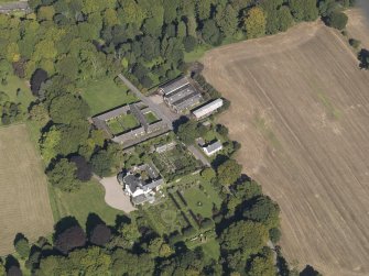 General oblique aerial view of the Pitmuies Estate, centred on  Pitmuies House, taken from the S.