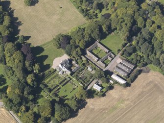 General oblique aerial view of the Pitmuies Estate, centred on  Pitmuies House, taken from the SE.