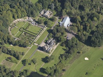 General oblique aerial view of the Guthrie Estate, centred on  Guthrie Castle, taken from the SW.