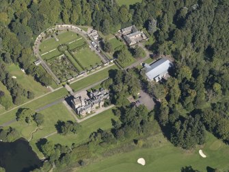 General oblique aerial view of the Guthrie Estate, centred on  Guthrie Castle, taken from the SSW.