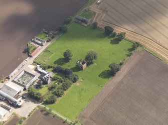 General oblique aerial view of Braikie Farm, centred on  Braikie Castle, taken from the WNW.