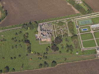 General oblique aerial view of the Ethie estate, centred on Ethie Castle, taken from the S.