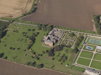 General oblique aerial view of the Ethie estate, centred on Ethie Castle, taken from theSSE.