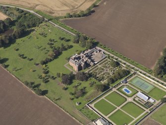 General oblique aerial view of the Ethie estate, centred on Ethie Castle, taken from the SE.