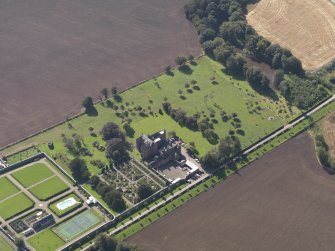 General oblique aerial view of the Ethie estate, centred on Ethie Castle, taken from the NE.