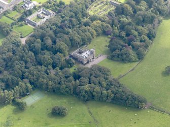 General oblique aerial view of the Dunninald estate, centred on Dunninald Castle, taken from the NW.
