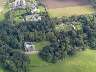 General oblique aerial view of the Dunninald estate, centred on Dunninald Castle, taken from the W.