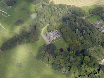 General oblique aerial view of the Dunninald estate, centred on Dunninald Castle, taken from the S.