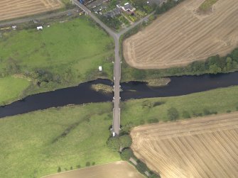 Oblique aerial view of Bridge of Dun, taken from the S.