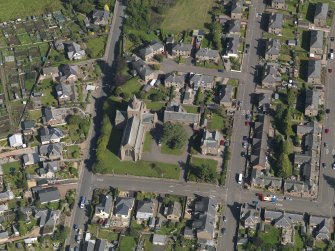 General oblique aerial view of the Montrose Road area of Forfar, centred on Lowson Memorial Church, taken from the W.