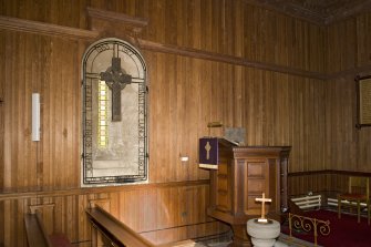 Interior. Memorial window, pulpit and font, view from S