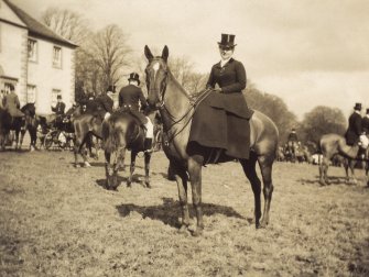 View of woman on horseback outside Duchal House, Renfrewshire.
