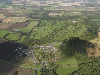 General aerial view of Glamis Castle and its Policies with Glamis Village in the immediate foreground taken from the SE.