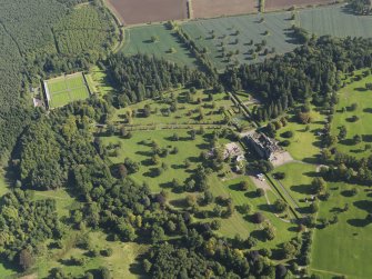 General oblique aerial view of Glamis Castle policies centred on Glamis Castle, taken from the W.