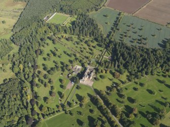 General oblique aerial view of Glamis Castle policies centred on Glamis Castle, taken from the SW.