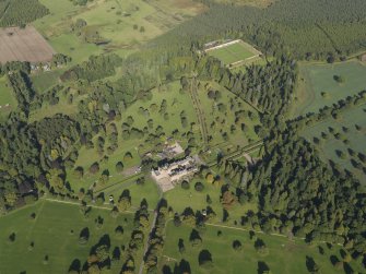 General oblique aerial view of Glamis Castle policies centred on Glamis Castle, taken from the S.