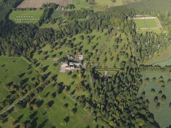 General oblique aerial view of Glamis Castle policies centred on Glamis Castle, taken from the SSE.