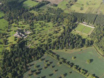 General oblique aerial view of Glamis Castle policies centred on Glamis Castle, taken from the SE.